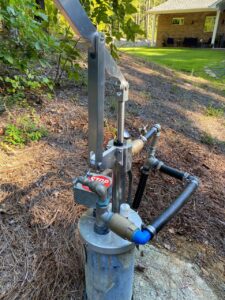 Well pump in a backyard of a home